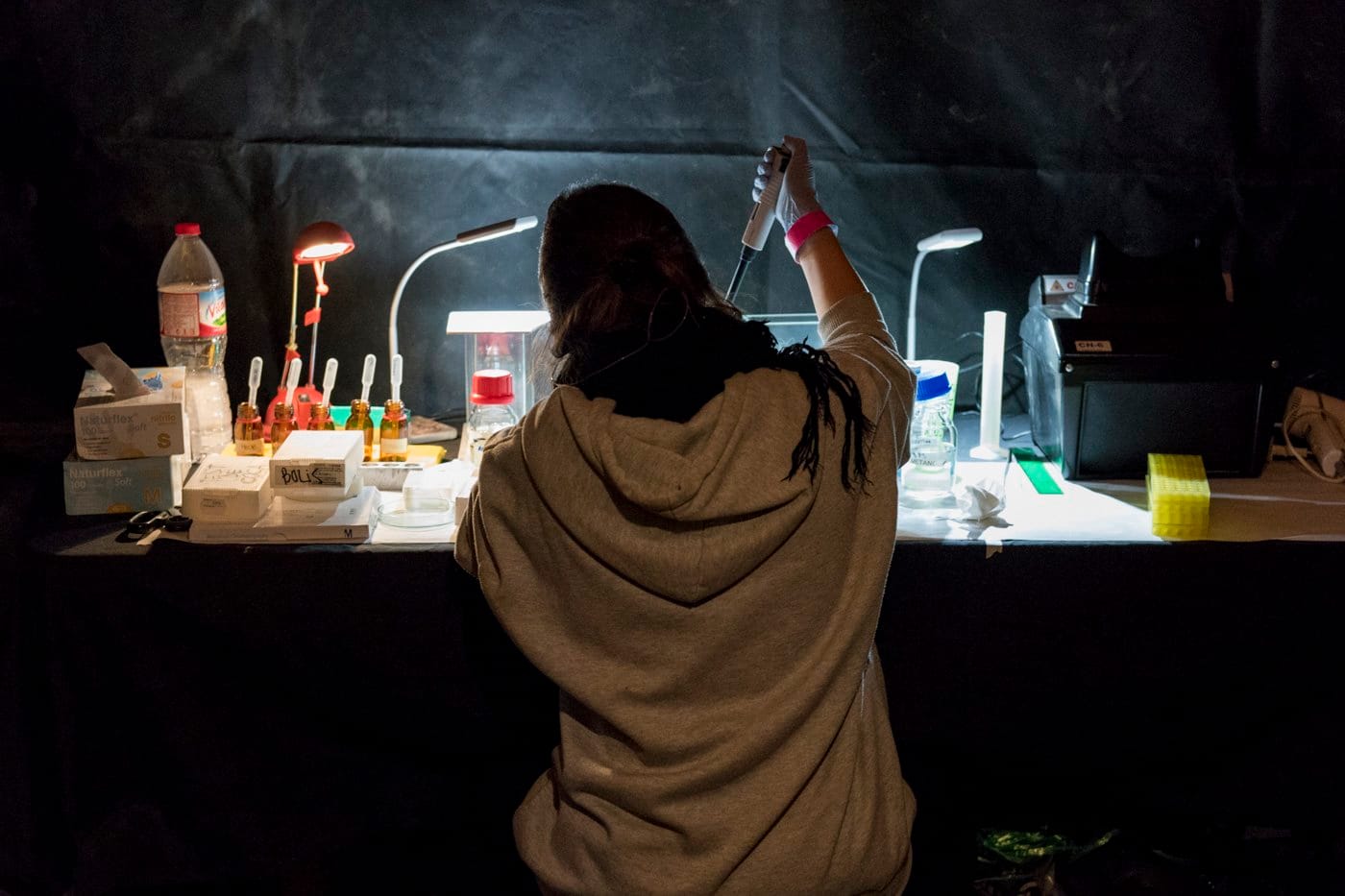 On-site analysis service Technical staff at a nightlife intervention preparing a sample for analysis.